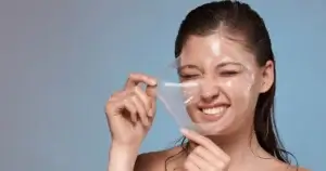 Woman peeling off VI Peel mask for glowing skin in Corpus Christi, TX spa