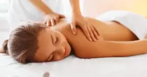 Women getting a relaxing massage therapy on her back at a spa in Corpus Christi, TX